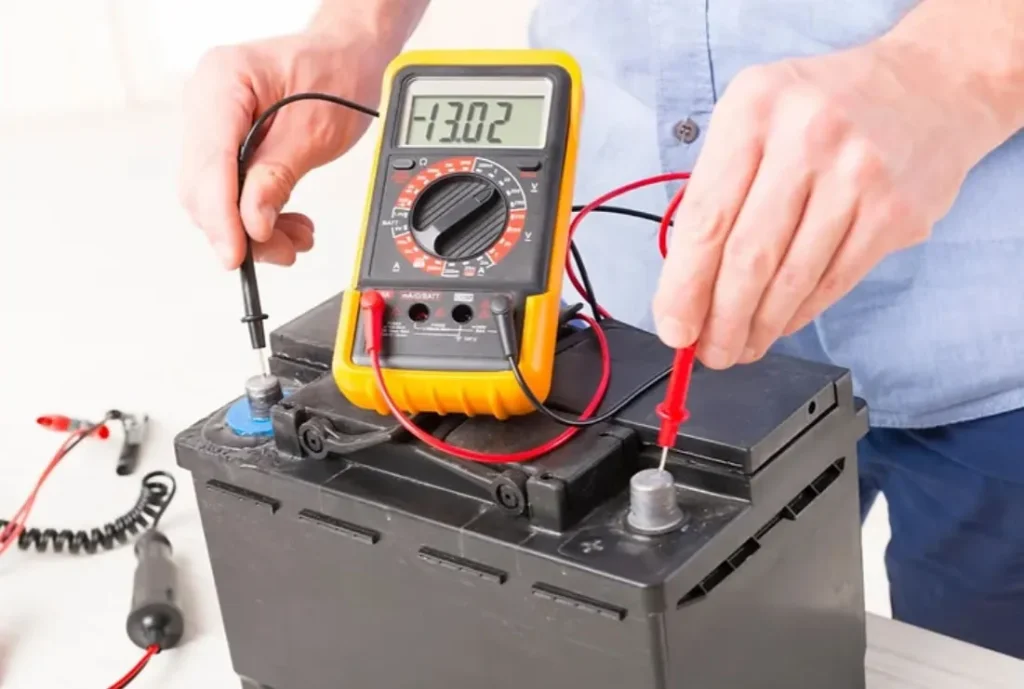someone testing a car battery